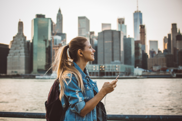 Woman in New York enjoying in skyline at dusk