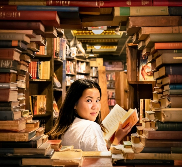 Woman in book stack